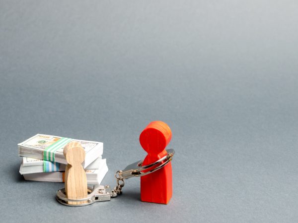 The parent is handcuffed to the child